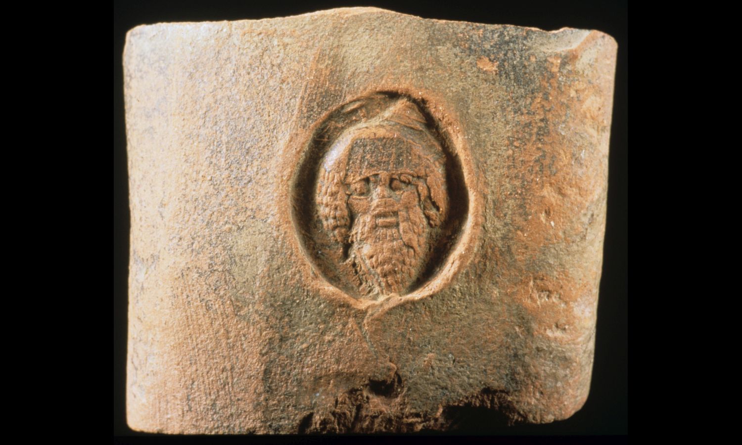 Amphora stamp with the head of Dionysus Botrys.