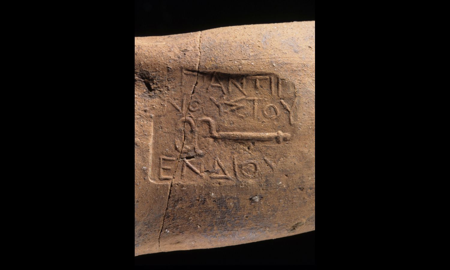 A Samothrace amphora stamp with a caduceus emblem of the Famous Antigenous of Endios.